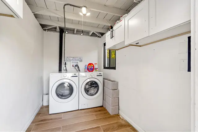 Laundry room at Light House with a washer and dryer